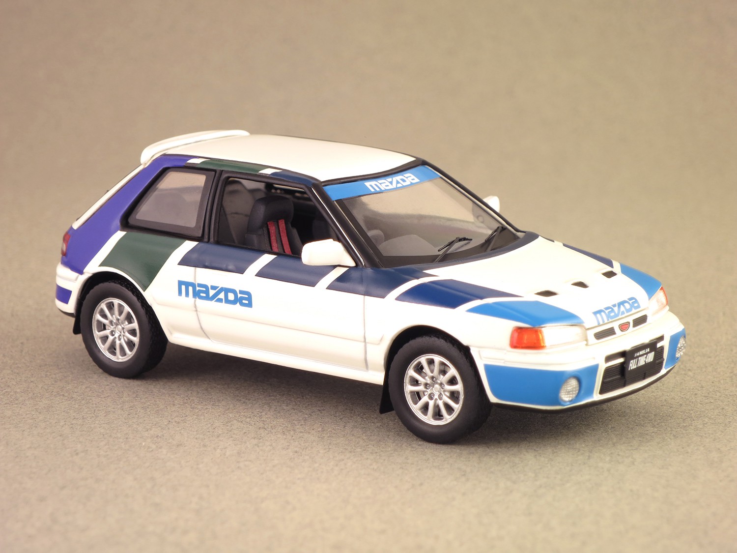 Mazda 323 GT-Ae (IXO) 1/43e